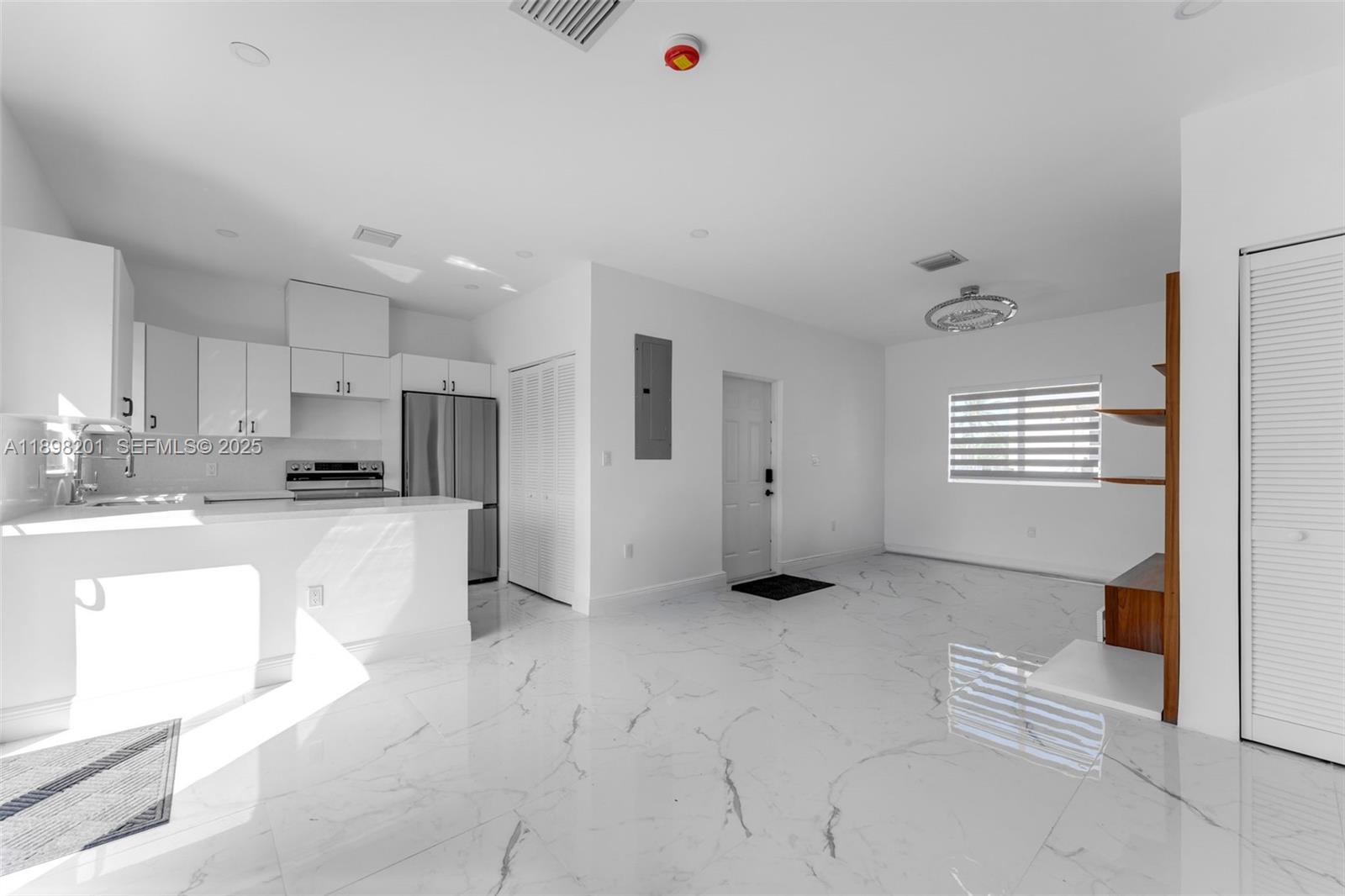 3840 Southwest 91 Avenue Miami, FL 33165 - Photo 10 of 24 a view of kitchen with stainless steel appliances refrigerator sink and cabinets