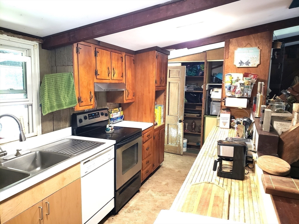 11 Taft Road Chester, MA 01011 - Photo 12 of 23 a kitchen with a stove a sink and a refrigerator