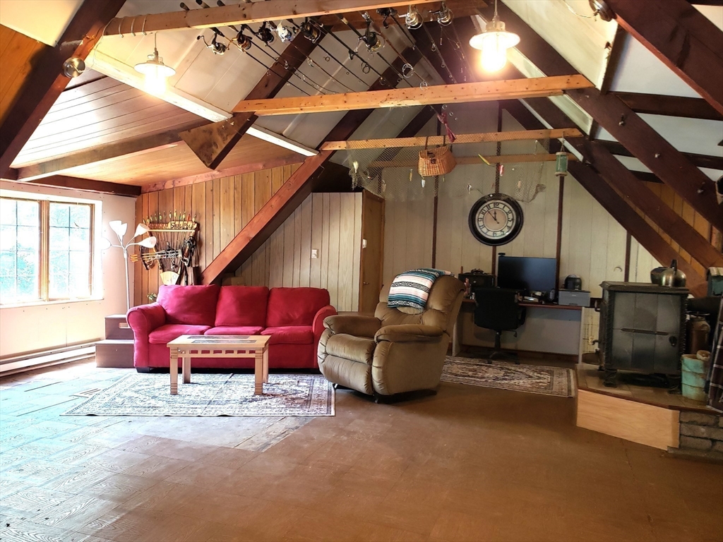 11 Taft Road Chester, MA 01011 - Photo 13 of 23 a living room with furniture and a clock
