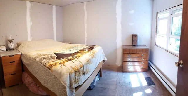 a bathroom with a sink mirror and toilet