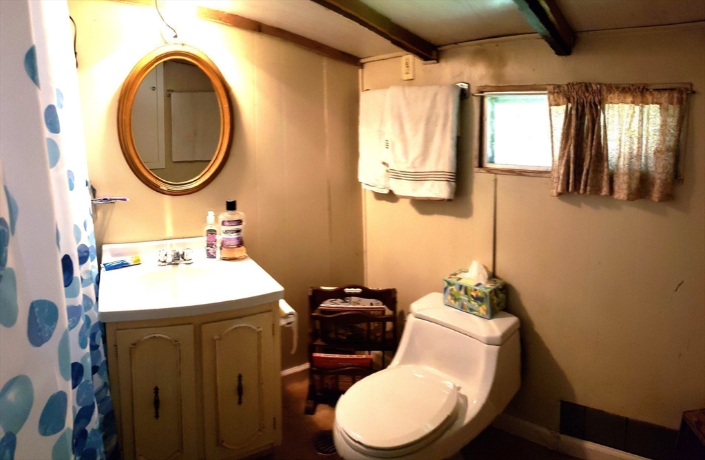 11 Taft Road Chester, MA 01011 - Photo 20 of 23 a bathroom with a sink mirror and toilet