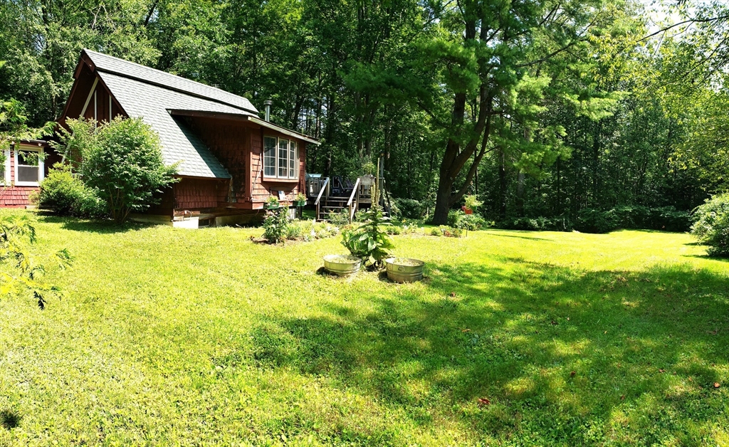 11 Taft Road Chester, MA 01011 - Photo 2 of 23 a view of a house with a yard