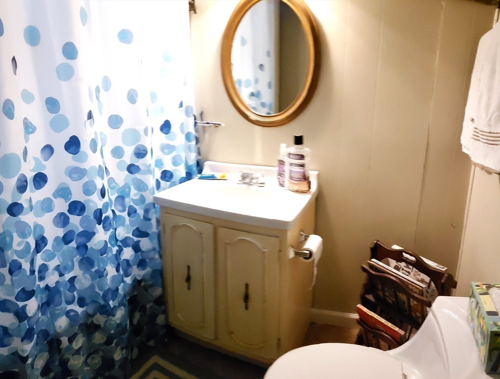 11 Taft Road Chester, MA 01011 - Photo 21 of 23 a bathroom with a sink mirror vanity and toilet