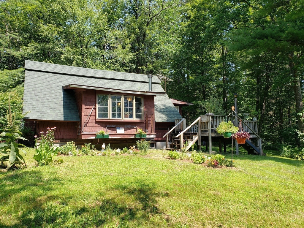 11 Taft Road Chester, MA 01011 - Photo 3 of 23 a backyard of a house with table and chairs