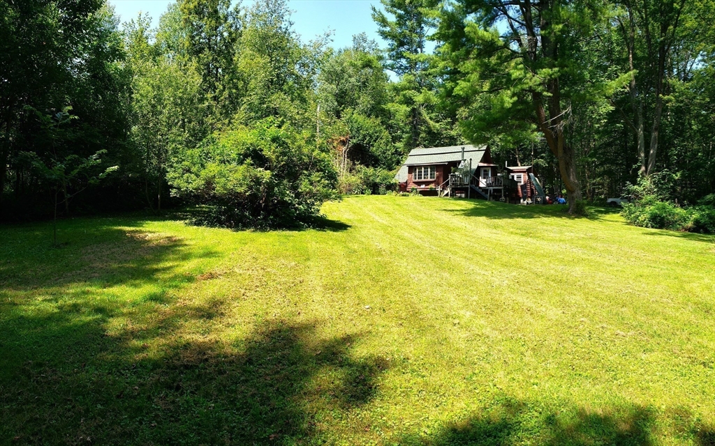 11 Taft Road Chester, MA 01011 - Photo 6 of 23 a swimming pool with trees in the background