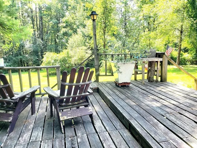 a view of a chairs and table on the balcony
