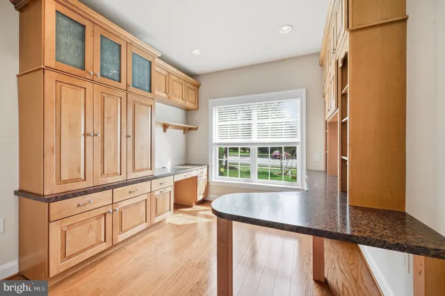 a view of kitchen island with wooden floor