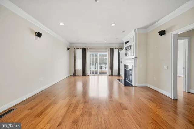 a view of a kitchen with a sink and a refrigerator
