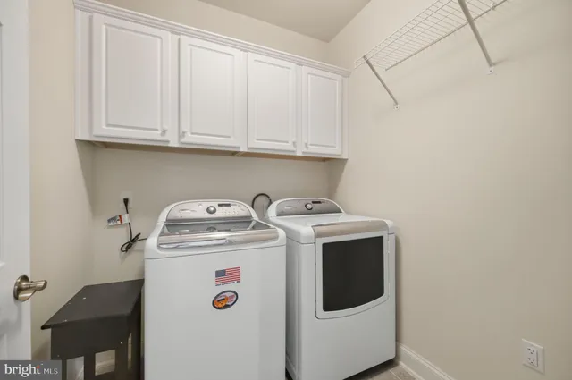 a bedroom with a large bed and a couch