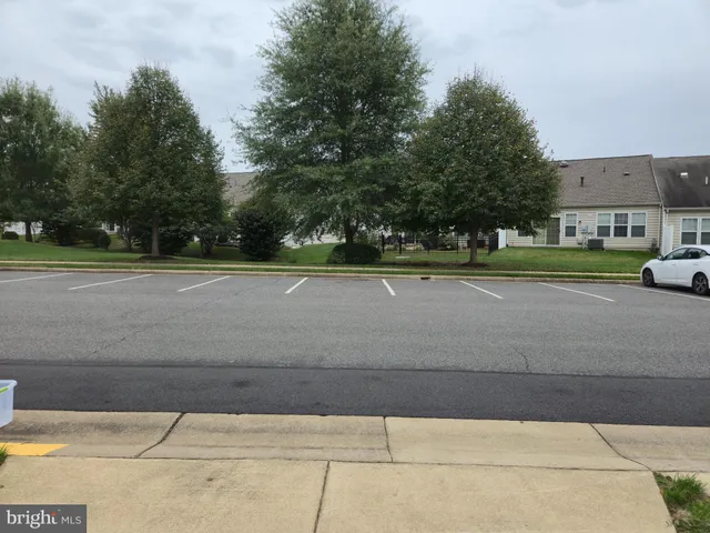 a outdoor living space with a couch and large window