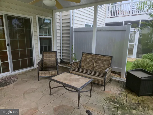 a outdoor living space with furniture and a garden