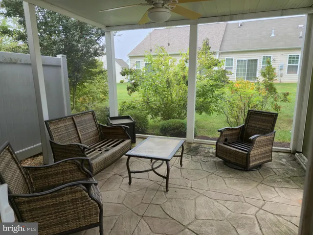 a view of a two chairs in the balcony