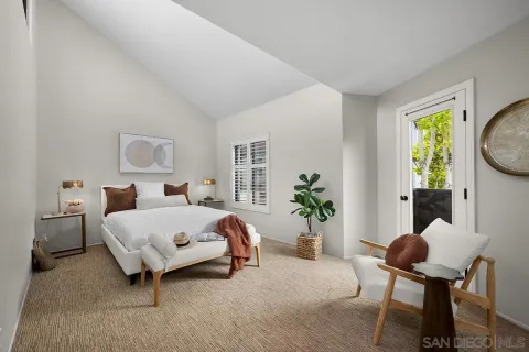 a bedroom with bed and a window