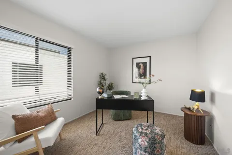 a work room with furniture and a window