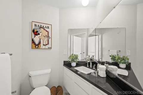 a dining room with furniture and potted plant