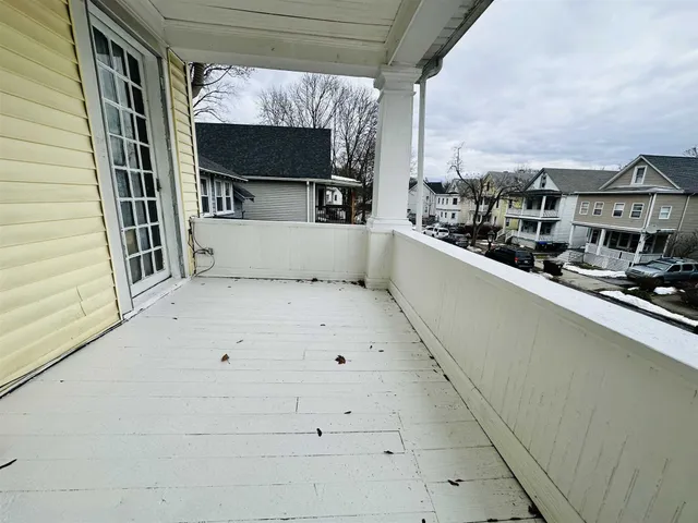 a view of a balcony with trees