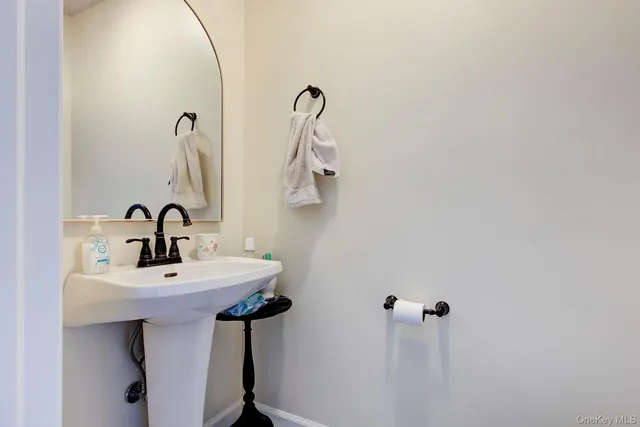a bathroom with a sink and mirror