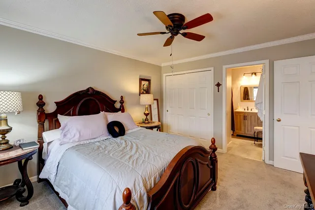 a bedroom with a bed and a view of bedroom