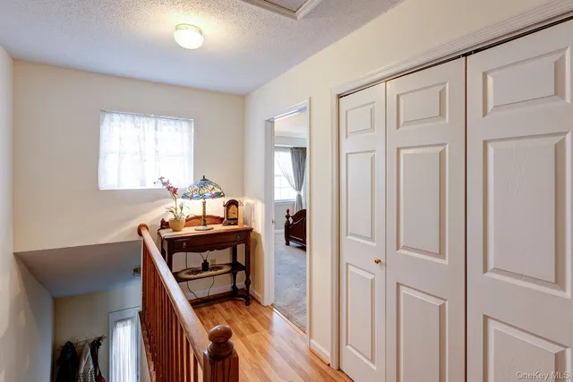 a bedroom with furniture and a window