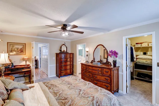 a bed room with a bed and a television