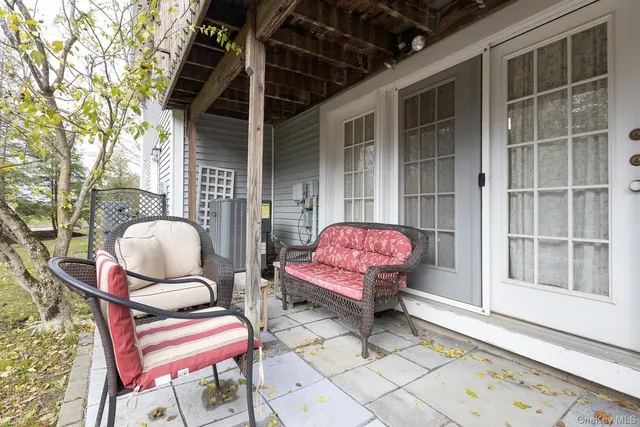 a patio with table and chairs