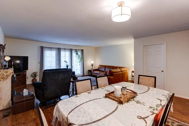 a bed room with furniture and wooden floor