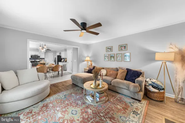a living room with furniture and a rug