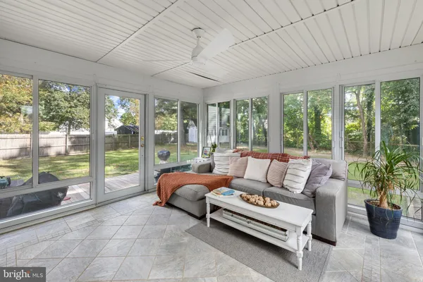 a living room with furniture and a garden