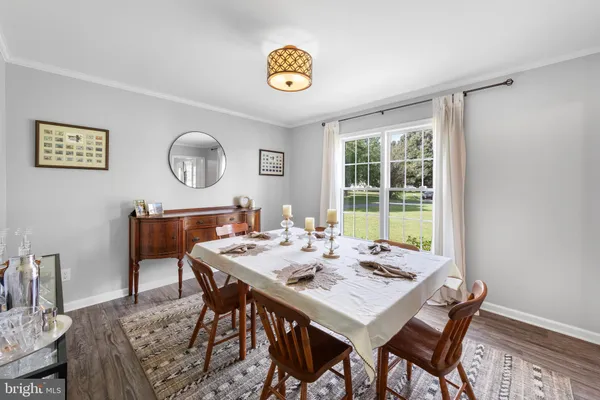 a view of a dining room and a table and chairs