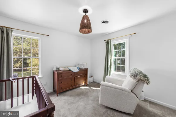 a living room with furniture and windows