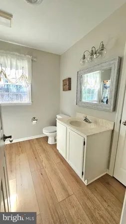 a view of utility room with wooden floor