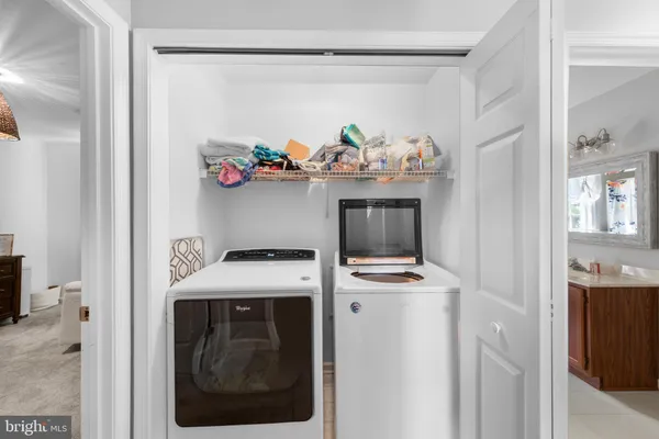 a room with a stove and cabinets