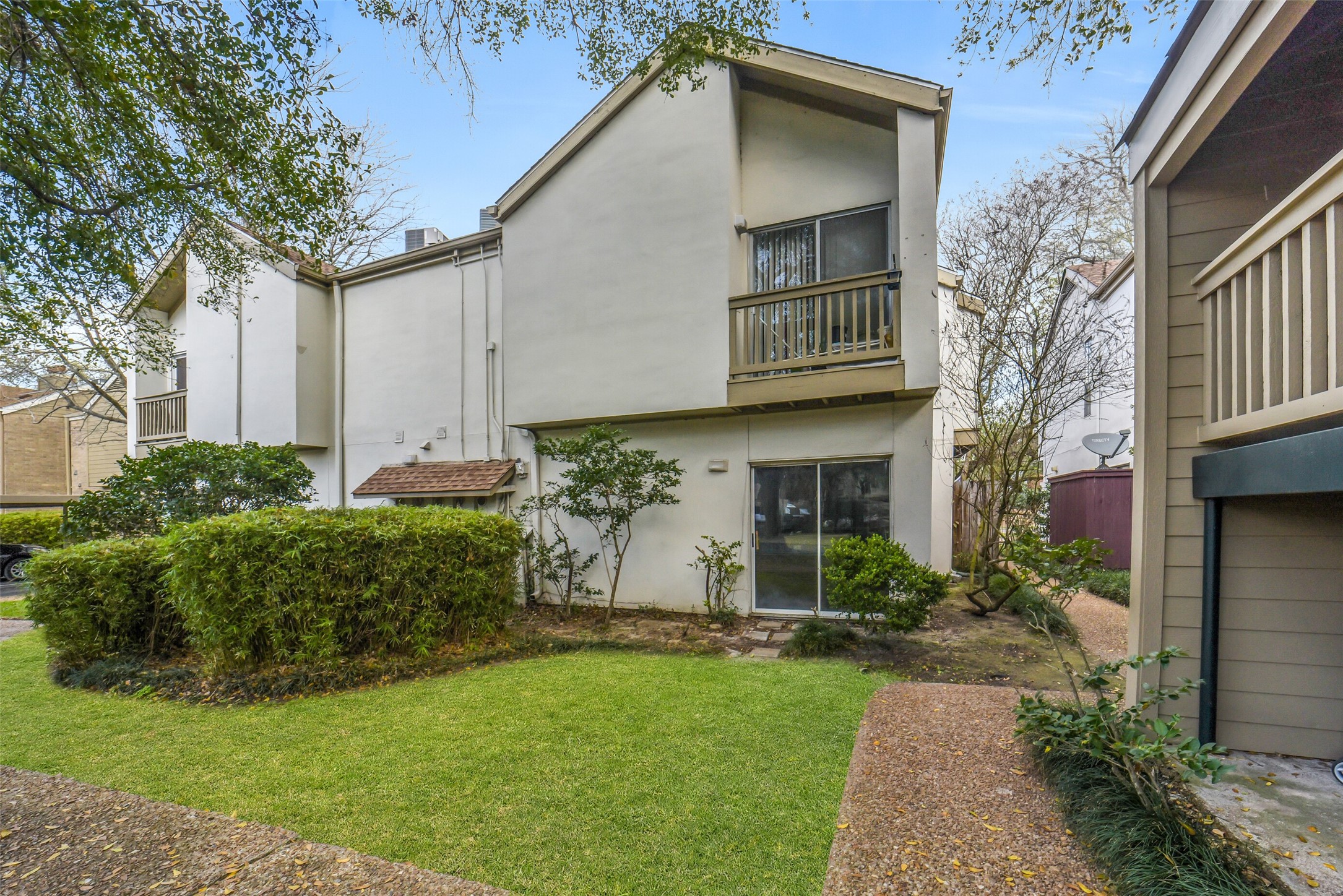 Updated FIRST floor CORNER condo located in the desirable community of Oaks of Woodlake in the Memorial area! Fridge, washer & dryer included!  Most furnishings available to purchase! 1 assigned covered parking. Wonderful community includes 24 hour manned entrance, 2 clubhouses, exercise room, 4 pools, dog park & walking trail. HOA INCLUDES: Electricity, trash, water, sewer. A great opportunity for low-maintenance living w/ convenience & exceptional amenities.