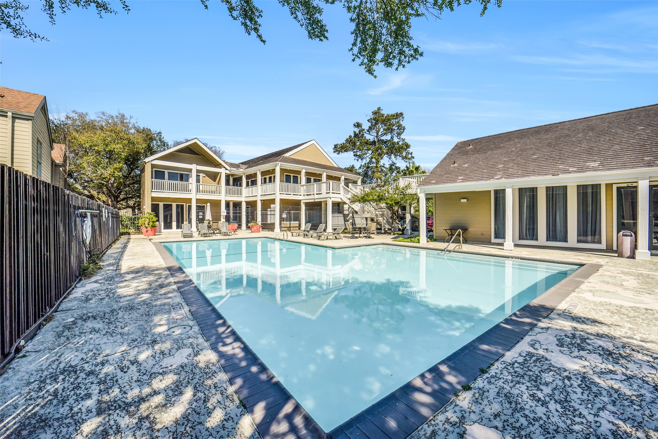 2100 Tanglewilde Street, Unit 591 Houston, TX 77063 - Photo 16 of 18 One more view of one of the 4 pools! Oaks of Woodlake is conveniently located in the Memorial area, providing easy access to Beltway 8, I-10, Westpark Tollway, Energy Corridor. Close to tons of popular shopping & dining at Memorial City, Town & County, City Center. Convenience meets low-maintenance living!