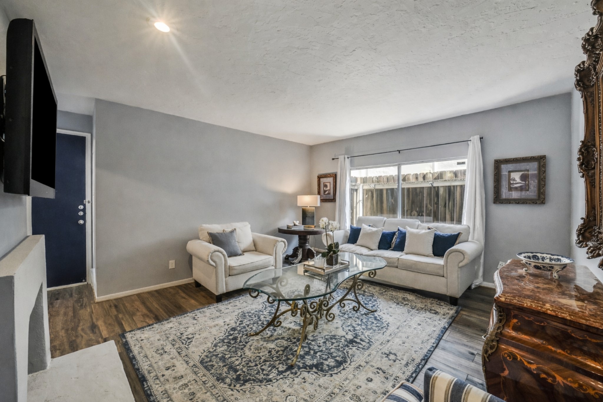 2100 Tanglewilde Street, Unit 591 Houston, TX 77063 - Photo 5 of 18 One more perspective of the spacious family room highlighting the generous scale and flexible layout. Plenty of room for a large furnishings while still maintaining open flow to the dining area and kitchen. Ample wall-space to showcase art.