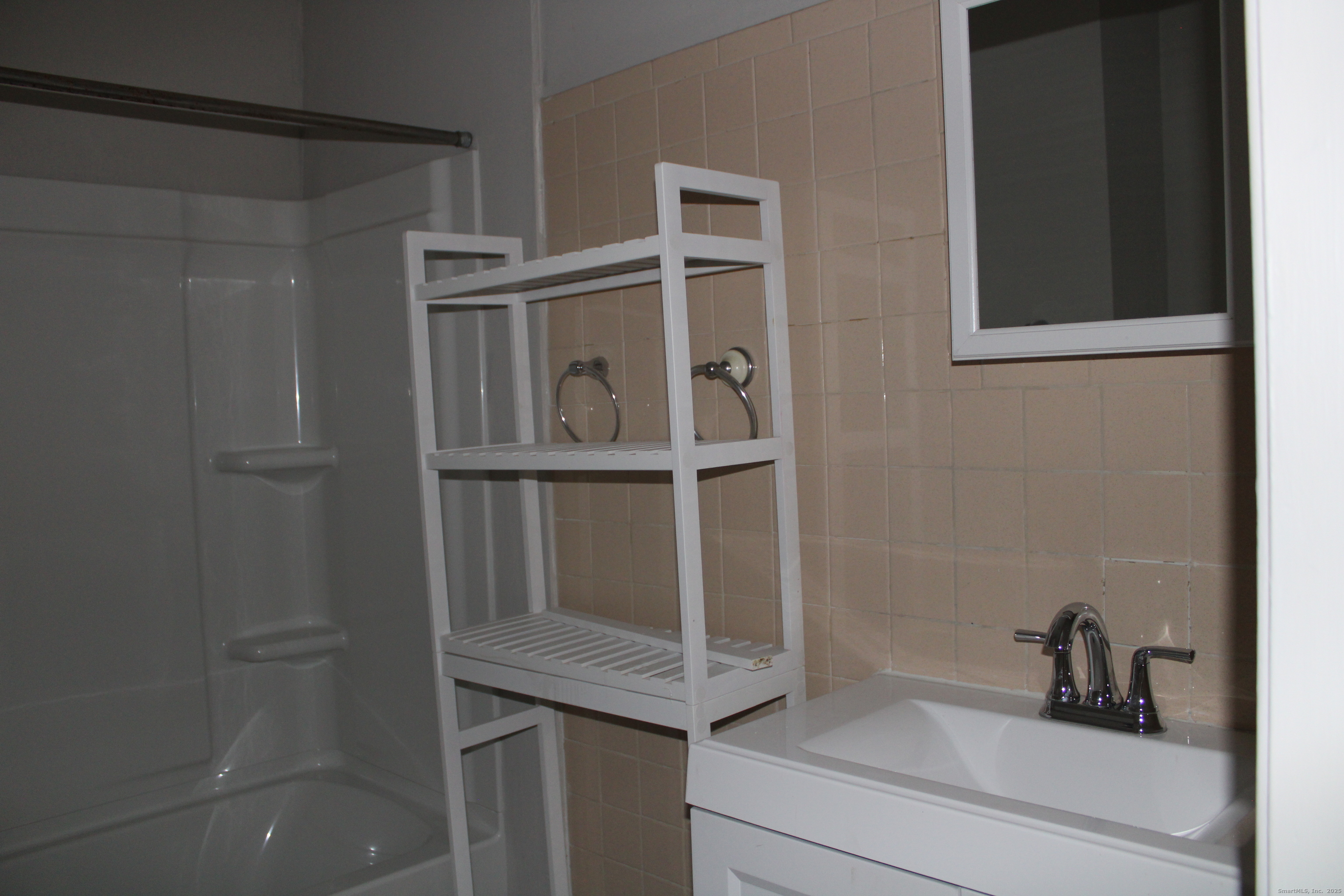 42 Summer Street, Unit 5 Bristol, CT 06010 - Photo 12 of 15 a bathroom with a bathtub and sink