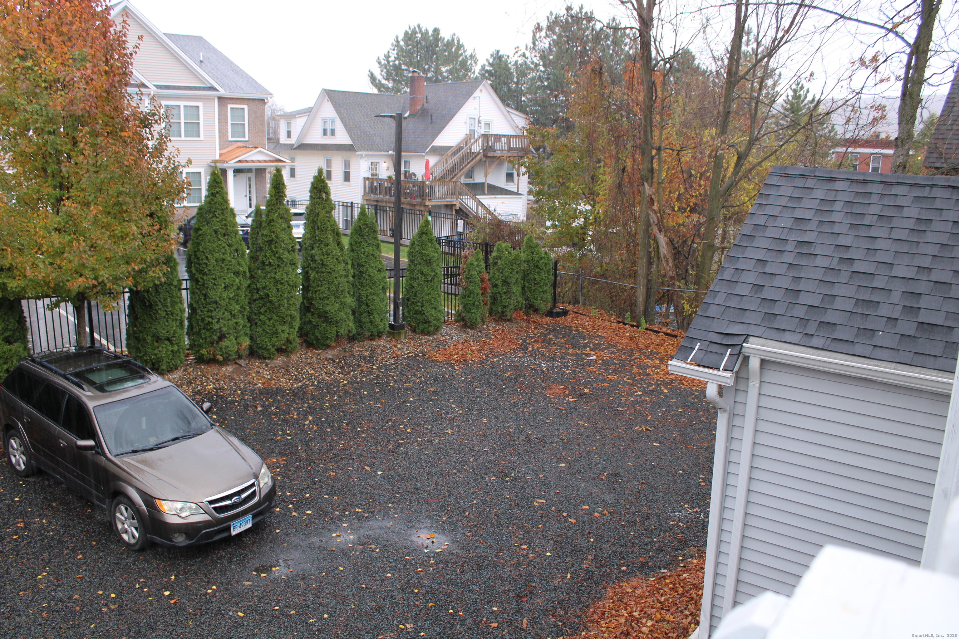 42 Summer Street, Unit 5 Bristol, CT 06010 - Photo 15 of 15 a view of a backyard with sitting area and tree