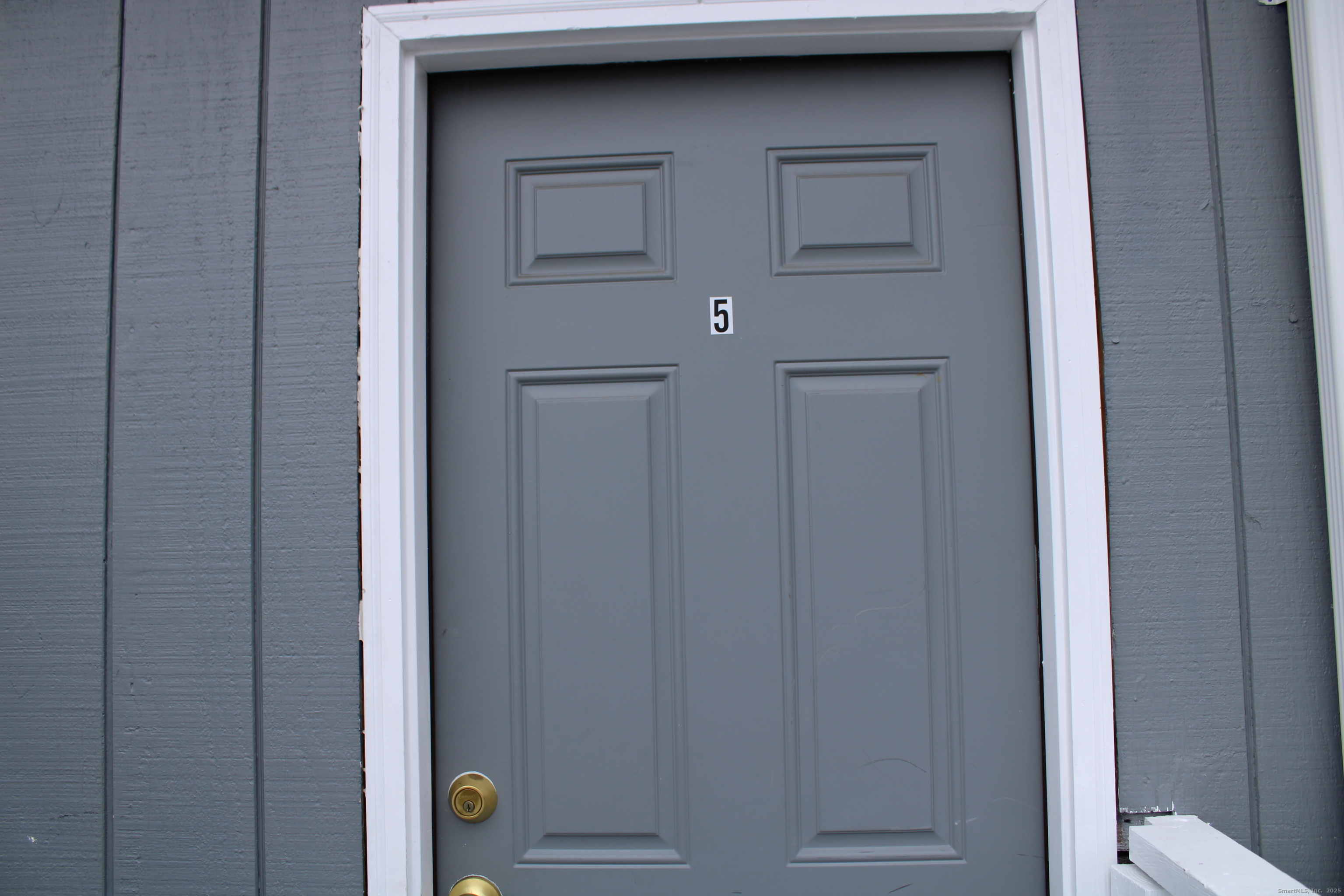 42 Summer Street, Unit 5 Bristol, CT 06010 - Photo 2 of 15 a view of a hallway with wooden door