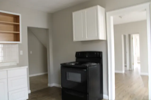 a view of a refrigerator and window in a room
