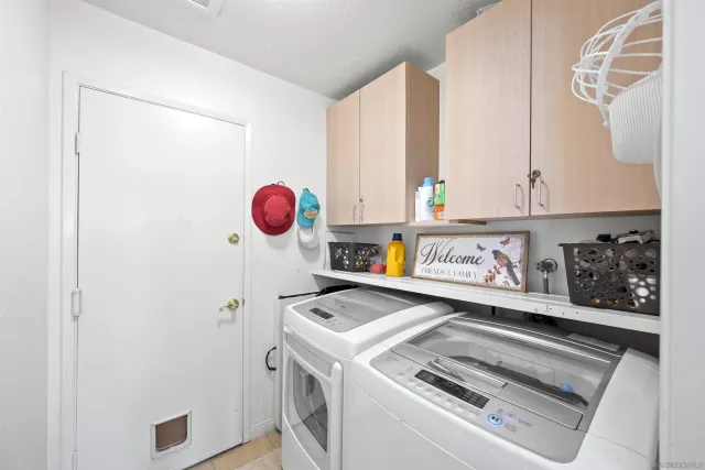 a kitchen with a refrigerator and a sink