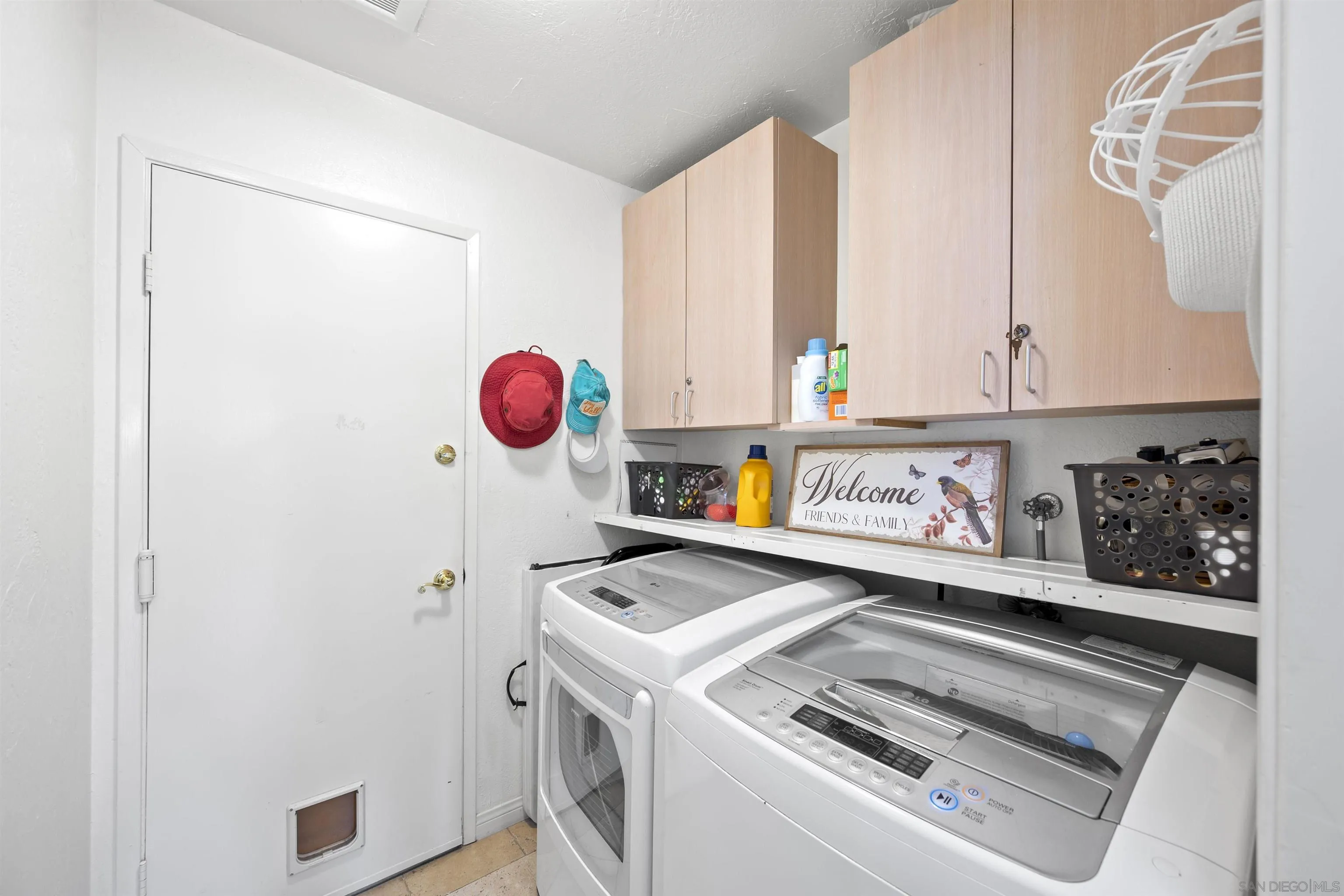 1510 Orangeview Drive, Unit 12 Encinitas, CA 92024 - Photo 11 of 19 a kitchen with a refrigerator and a sink