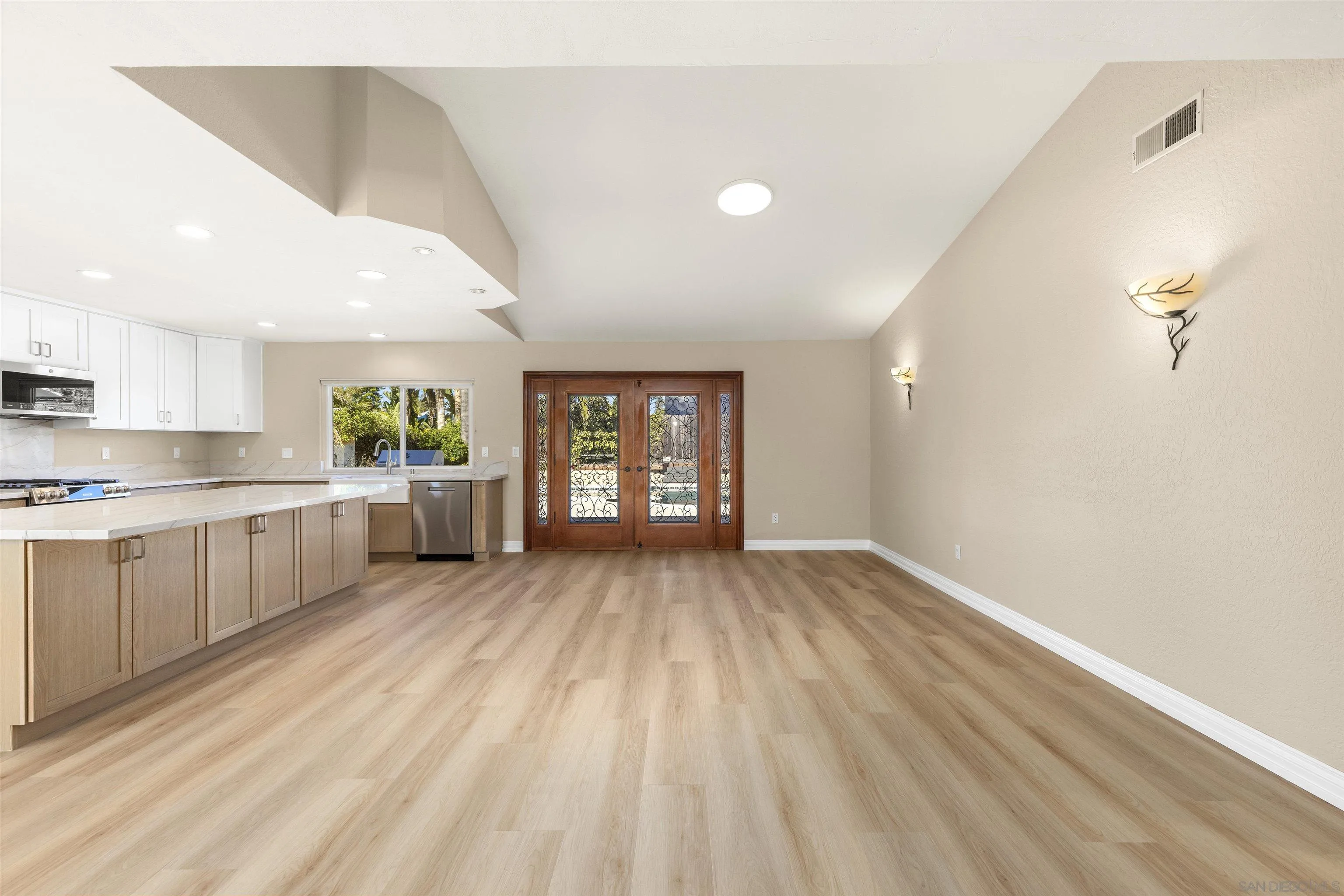 1510 Orangeview Drive, Unit 12 Encinitas, CA 92024 - Photo 12 of 55 a view of a kitchen with a sink and cabinets