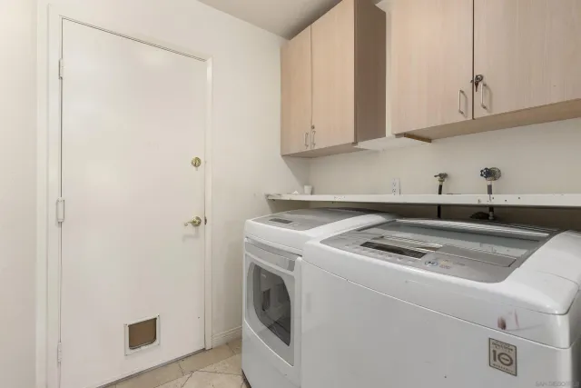 a kitchen with a sink and a stove top oven