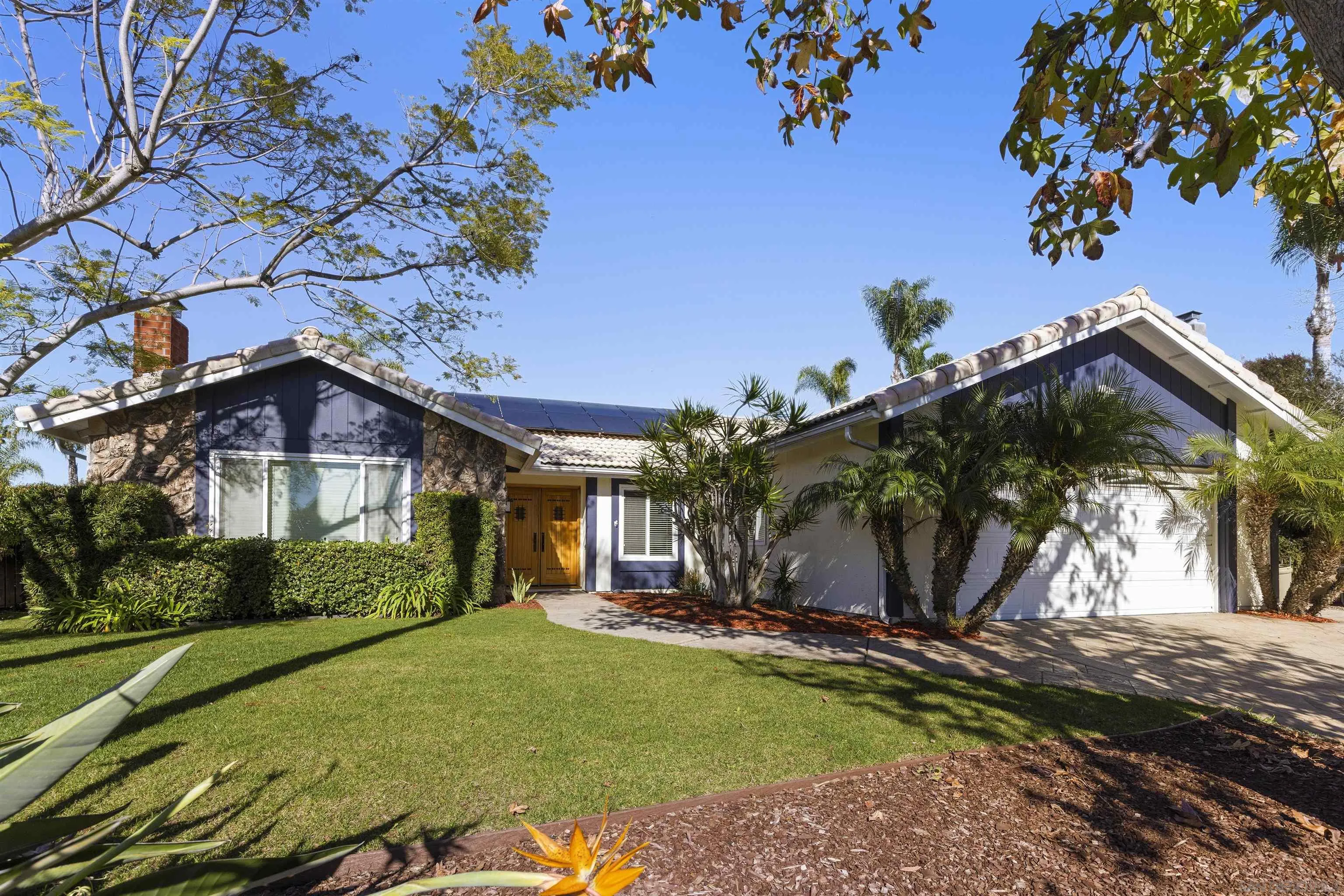 1510 Orangeview Drive, Unit 12 Encinitas, CA 92024 - Photo 17 of 19 a front view of a house with a yard