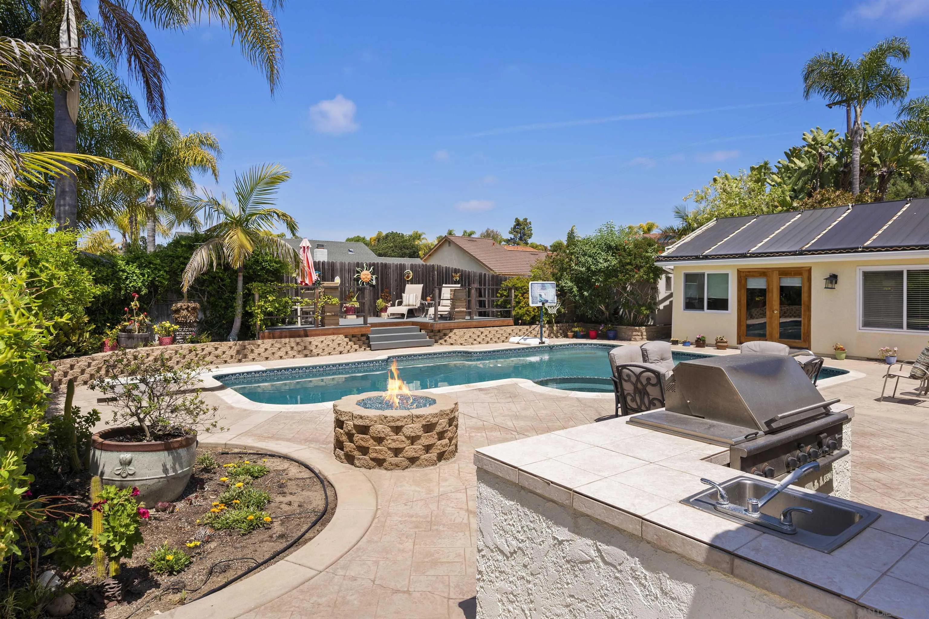 1510 Orangeview Drive, Unit 12 Encinitas, CA 92024 - Photo 2 of 19 a view of a backyard with plants and patio