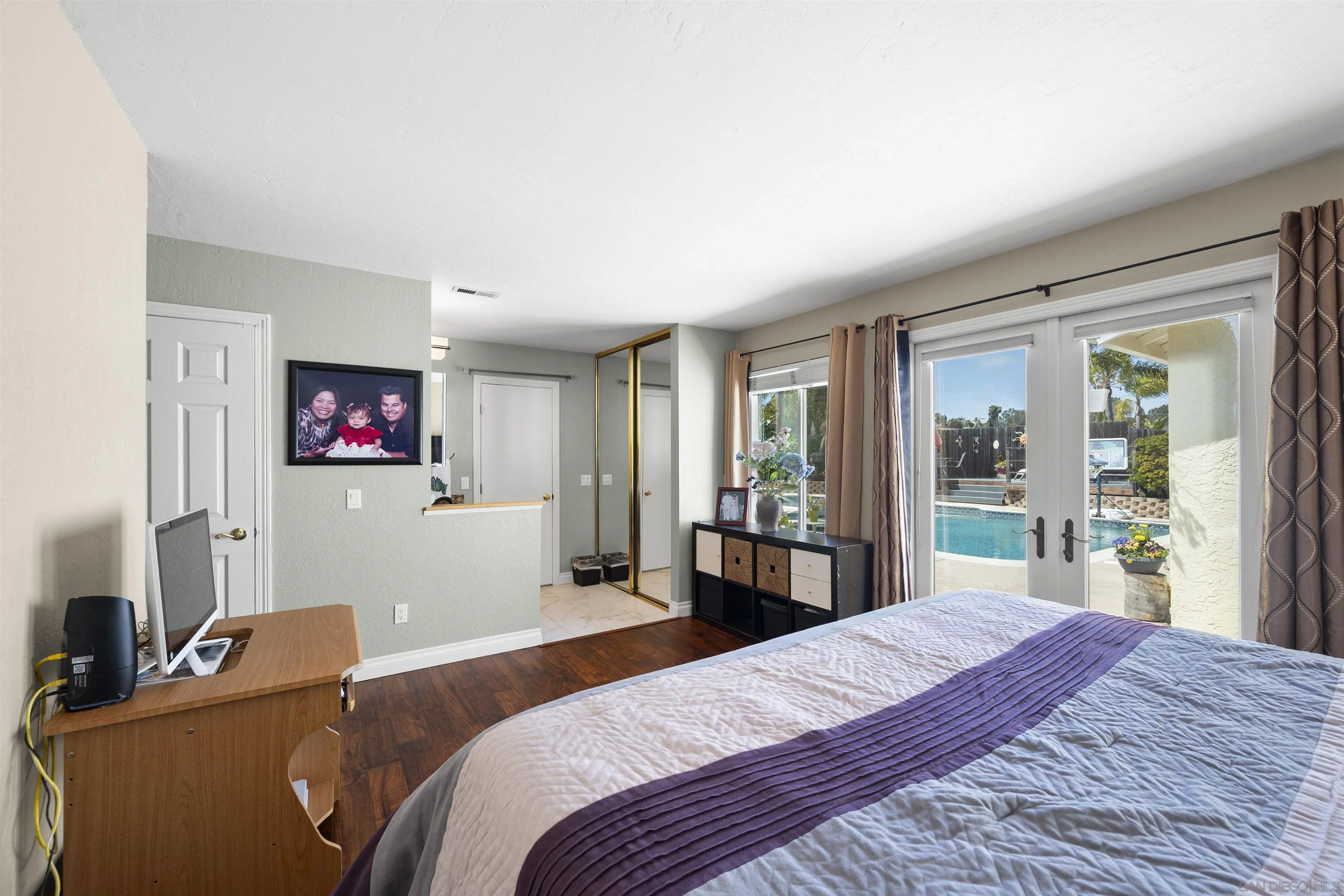 1510 Orangeview Drive, Unit 12 Encinitas, CA 92024 - Photo 31 of 55 a bedroom with a bed and a large window