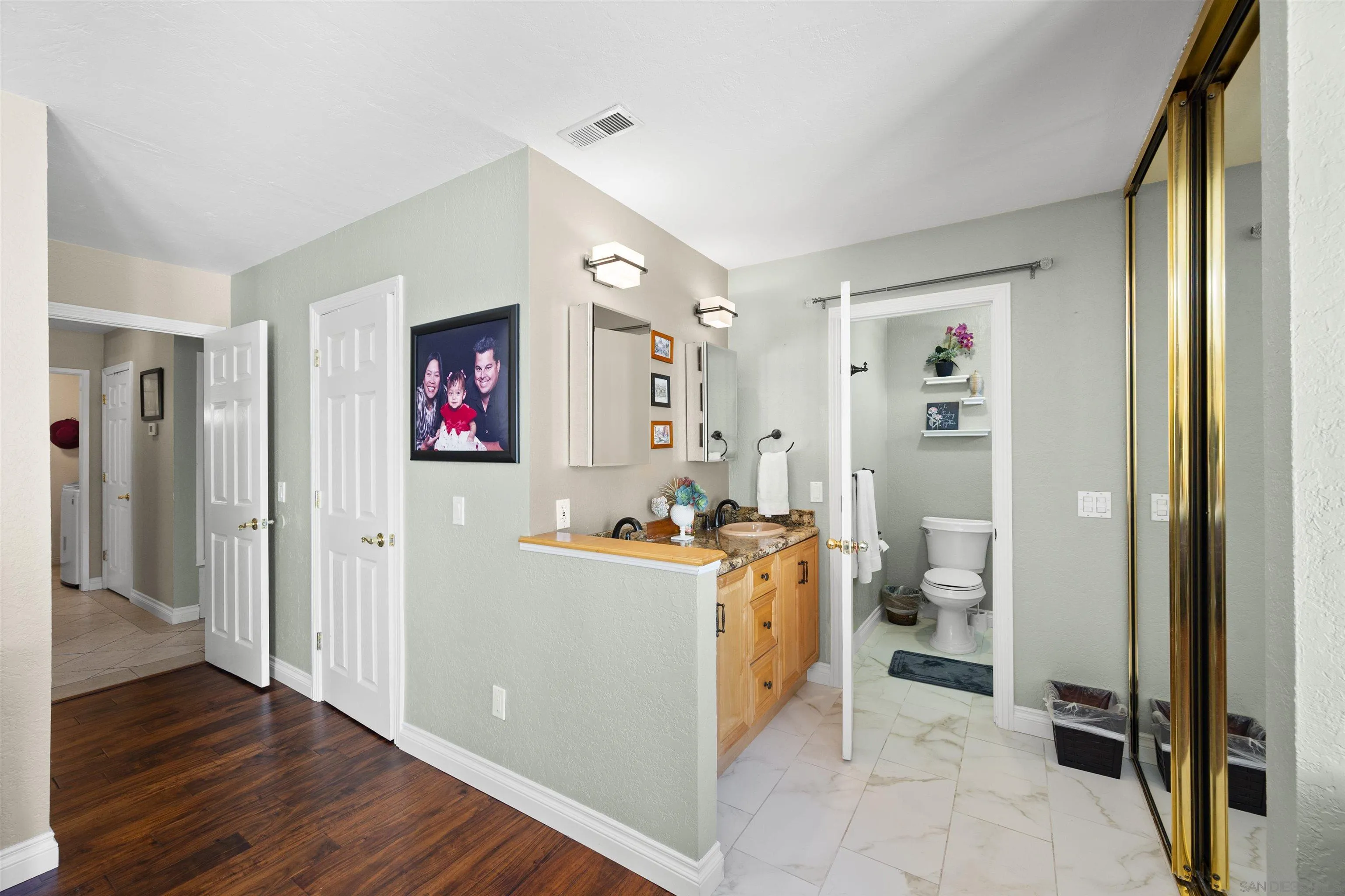 1510 Orangeview Drive, Unit 12 Encinitas, CA 92024 - Photo 32 of 55 a view of a workspace with wooden floor and furniture