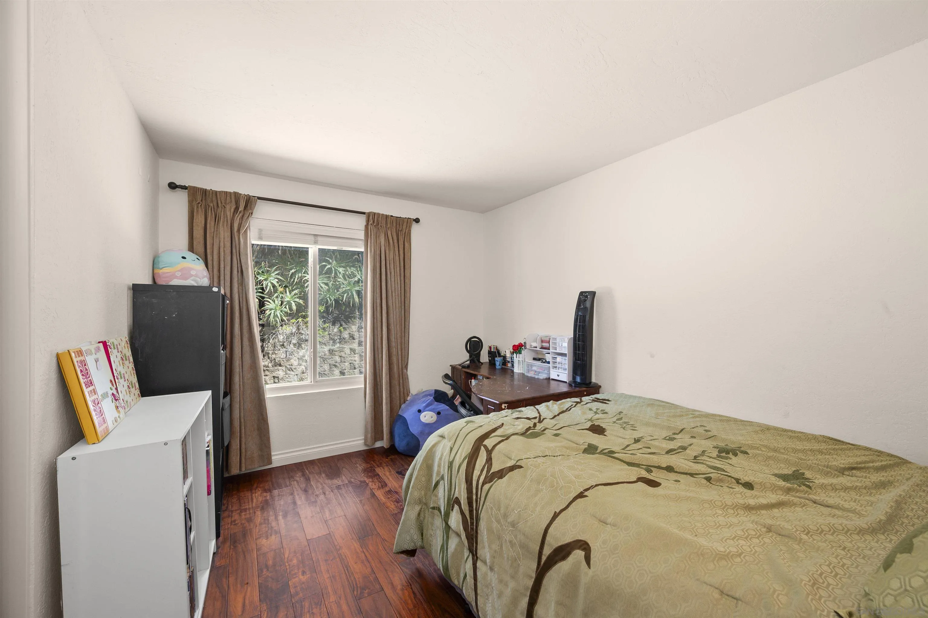 1510 Orangeview Drive, Unit 12 Encinitas, CA 92024 - Photo 36 of 55 a bed sitting in a bedroom next to a window