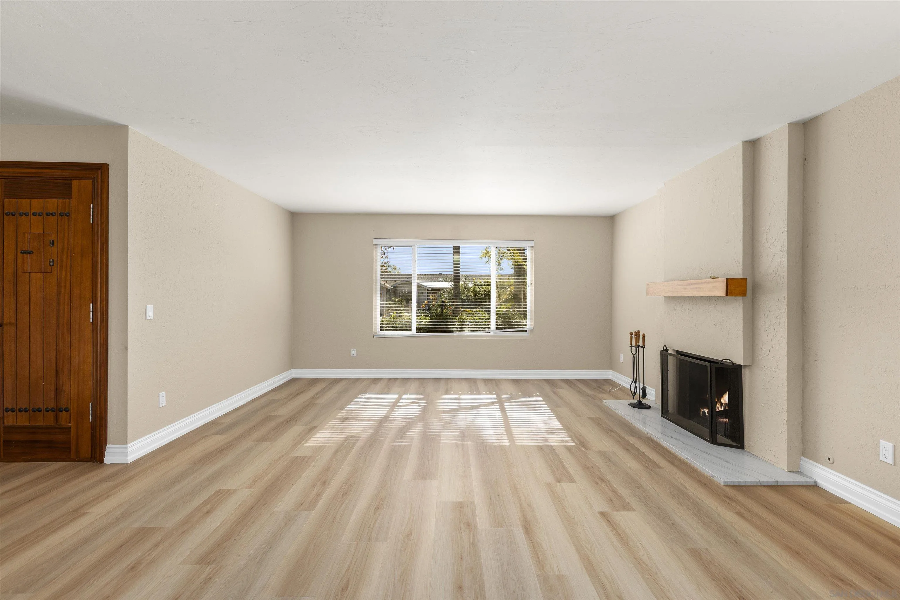 1510 Orangeview Drive, Unit 12 Encinitas, CA 92024 - Photo 4 of 55 wooden floor in an empty room with a fireplace