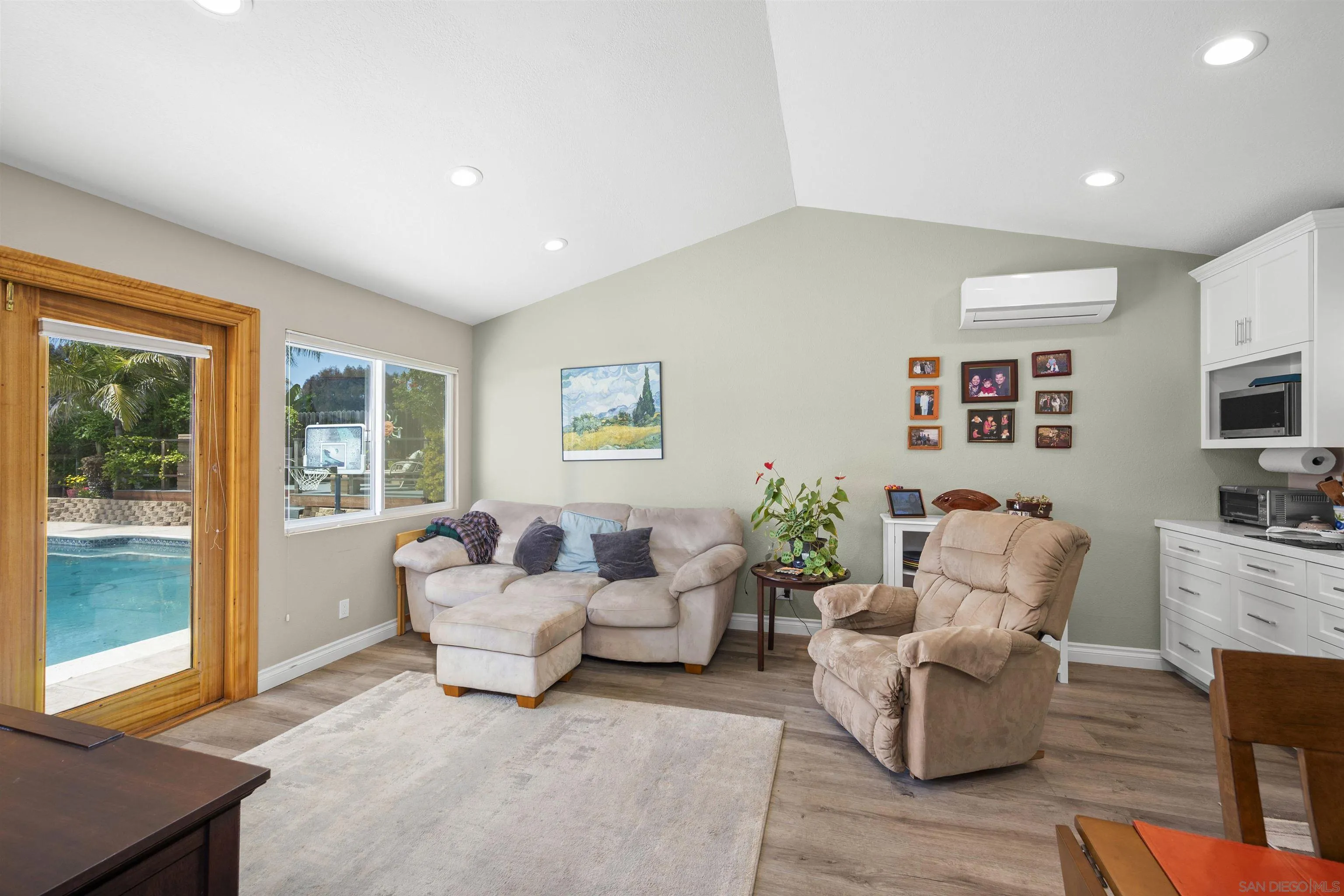 1510 Orangeview Drive, Unit 12 Encinitas, CA 92024 - Photo 41 of 55 a living room with furniture flat screen tv and a large window